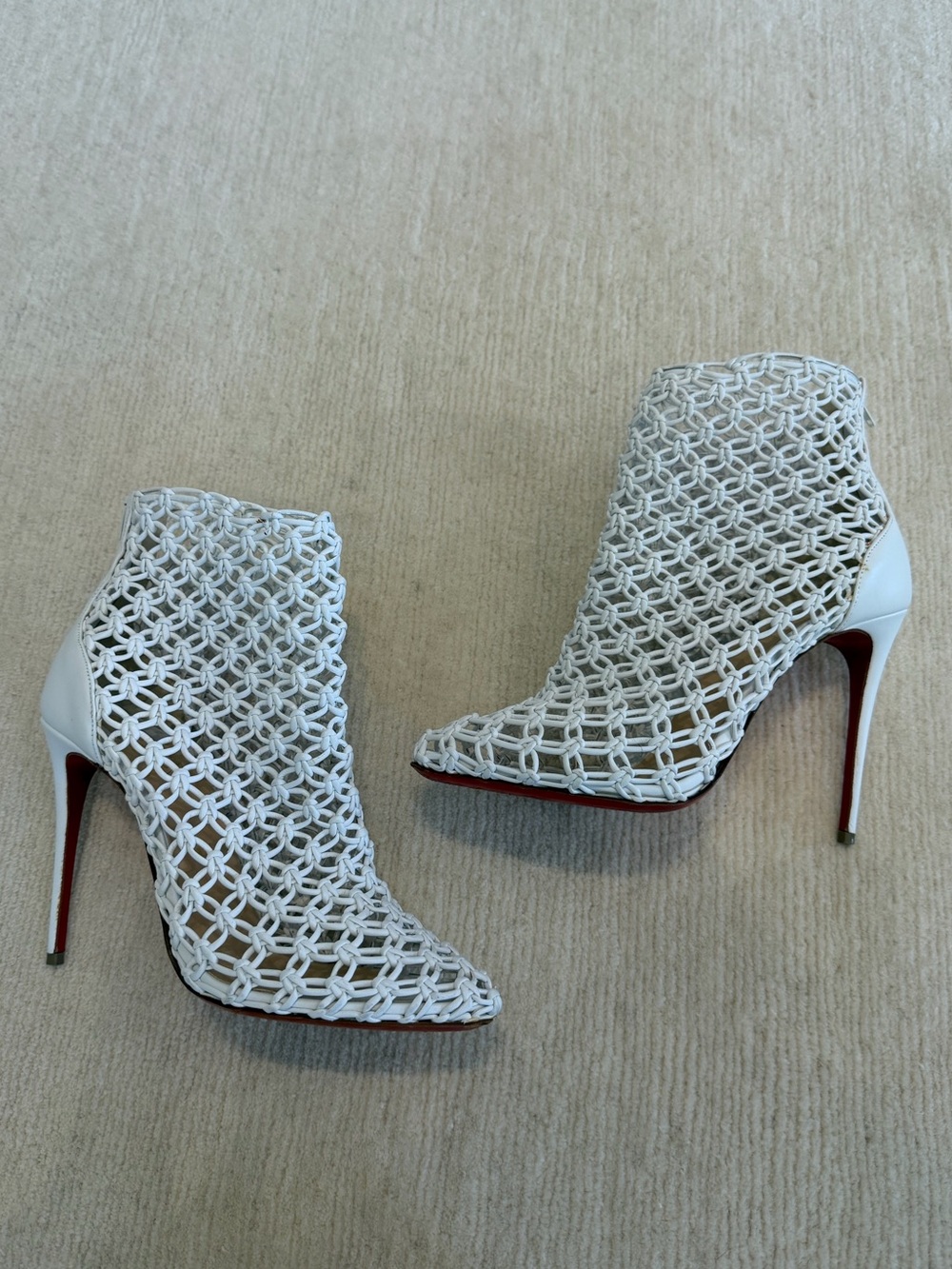 Christian Louboutin Porligat white leather caged ankle boots.